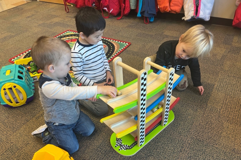 Two-year-olds playing with toys