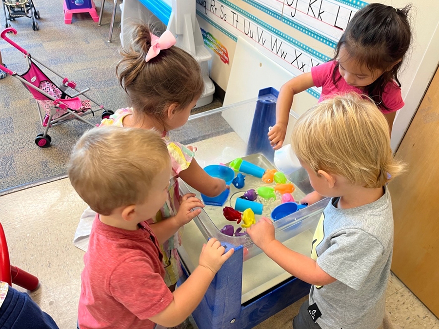 kids playing at water table