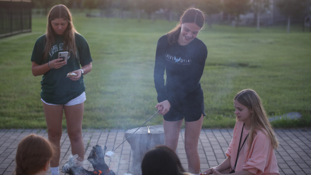 students outside at bonfire