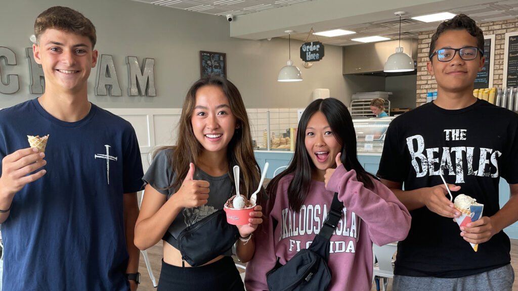 students holding up ice cream